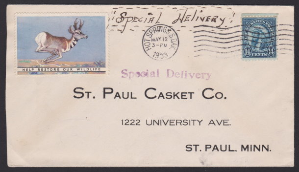 Front of St. Paul Casket Company cover bearing 14-cent American Indian stamp and pronghorn antelope poster stamp