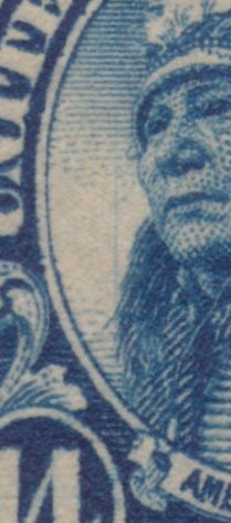 Detail showing vertical scratch to left of face on 14¢ American Indian stamp