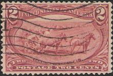 Dark red 2-cent U.S. postage stamp picturing horses and plow