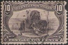 Black 10-cent U.S. postage stamp picturing emigrants with covered wagon