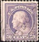 Purple 50-cent U.S. postage stamp picturing Benjamin Franklin