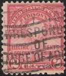 Red 2-cent U.S. postage stamp picturing a lightbulb