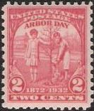 Red 2-cent U.S. postage stamp picturing two children planting a tree