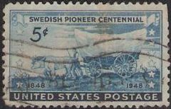 Blue 5-cent U.S. postage stamp picturing covered wagon