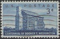 Blue 3-cent U.S. postage stamp picturing log cabin