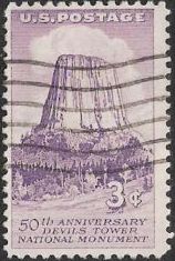 Purple 3-cent U.S. postage stamp picturing Devils Tower