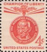 Red orange 4-cent U.S. postage stamp picturing Mahatma Gandhi
