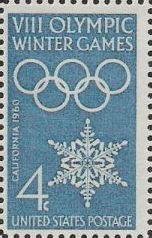 Blue 4-cent U.S. postage stamp picturing Olympic rings and snowflake