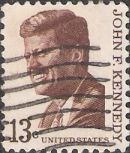 Brown 13-cent U.S. postage stamp picturing John F. Kennedy