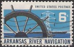 Blue and black 6-cent U.S. postage stamp picturing wheel, power line tower, and barge