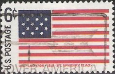 Blue and red 6-cent U.S. postage stamp picturing Fort McHenry flag