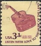 Brown 3.1-cent U.S. postage stamp picturing guitar