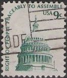 Green 9-cent U.S. postage stamp picturing U.S. Capitol