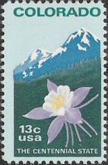 13-cent U.S. postage stamp picturing flower and mountains