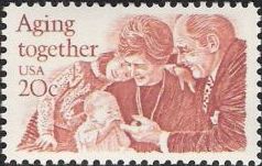 Red 20-cent U.S. postage stamp picturing man, woman, and two children