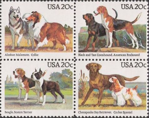 Block of four 20-cent U.S. postage stamps picturing dogs