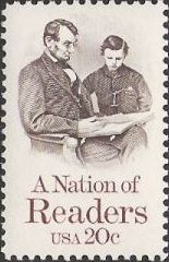 Brown & maroon 20-cent U.S. postage stamp picturing Abraham and Tad Lincoln