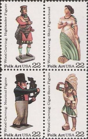 Block of four 22-cent U.S. postage stamps picturing carved wooden figures