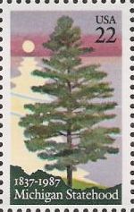 22-cent U.S. postage stamp picturing pine tree and lake