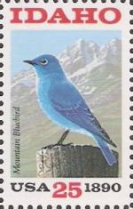 25-cent U.S. postage stamp picturing mountain bluebird and mountains