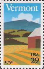 29-cent U.S. postage stamp picturing barn, field, and hills