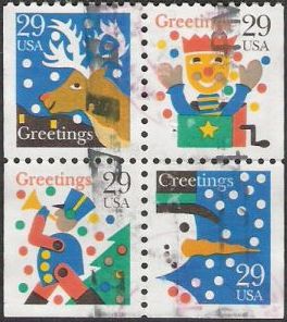 Block of four 29-cent U.S. postage stamps picturing reindeer, jack in the box, toy soldier, and snowman