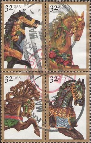 Block of four 32-cent U.S. postage stamps picturing carousel horses