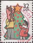32-cent U.S. postage stamp picturing man and children decorating Christmas Tree