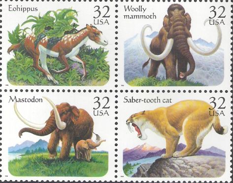 Block of four 32-cent U.S. postage stamps picturing prehistoric animals