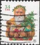 34-cent U.S. postage stamp picturing Santa Claus holding toys and tree
