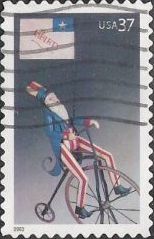 37-cent U.S. postage stamp picturing toy Uncle Sam on bicycle with flag