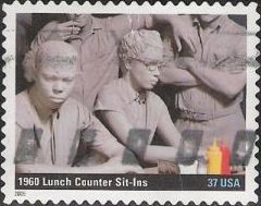 37-cent U.S. postage stamp picturing sculpture of people sitting in restaurant