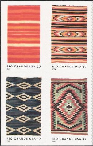Block of four 37-cent U.S. postage stamps picturing blankets