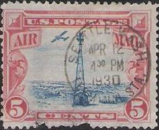 Red & blue 5-cent U.S. postage stamp picturing beacon and airplane