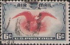 Blue & red 6-cent U.S. postage stamp picturing eagle holding shield