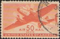 Orange 30-cent U.S. postage stamp picturing airplane
