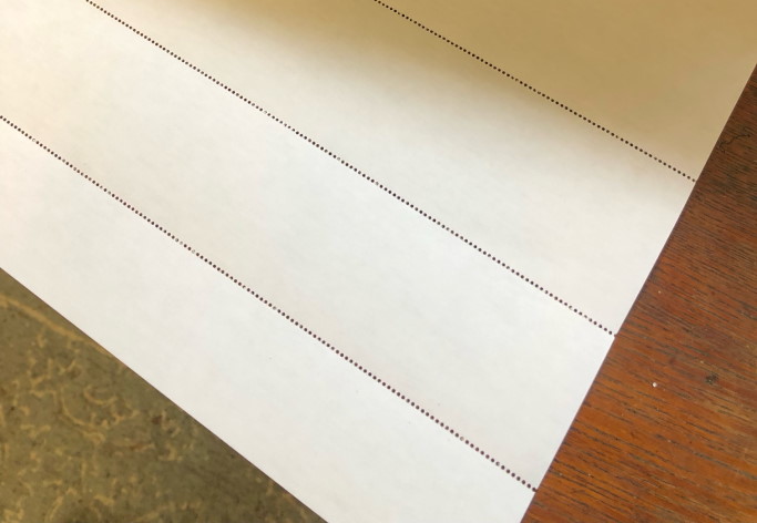 Sheet of paper with lines of perforations