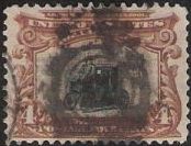 Brown & black 4-cent U.S. postage stamp picturing automobile