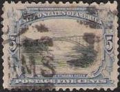 Blue & black 5-cent U.S. postage stamp picturing bridge at Niagara Falls