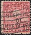 Red 2-cent U.S. postage stamp picturing a lightbulb