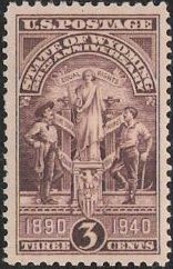 Brown 3-cent U.S. postage stamp picturing Wyoming State Seal