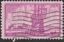 Red violet 3-cent U.S. postage stamp picturing ship and New York City skyline