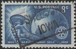 Blue 8-cent U.S. postage stamp picturing hand holding torch, globe, and Rotary International logo