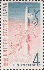 Blue and pink 4-cent U.S. postage stamp picturing Washington Monument and cherry blossoms