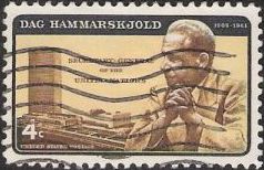Black and yellow 4-cent U.S. postage stamp picturing Dag Hammarskjold and United Nations headquarters