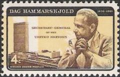 Black and yellow (with yellow inverted) 4-cent U.S. postage stamp picturing Dag Hammarskjold and United Nations headquarters