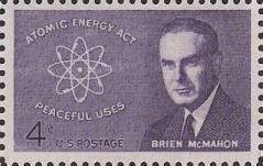 Purple 4-cent U.S. postage stamp picturing Brien McMahon and atom