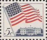 Blue and red 5-cent U.S. postage stamp picturing American flag and White House