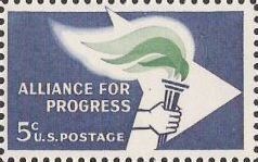 Blue and green 5-cent U.S. postage stamp picturing hand holding torch