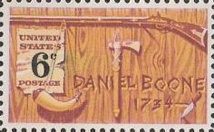 6-cent U.S. postage stamp picturing frontier weapons and tools